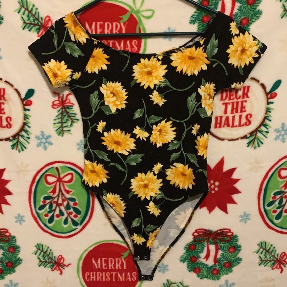Black and yellow bodysuit. Brand new with tag.